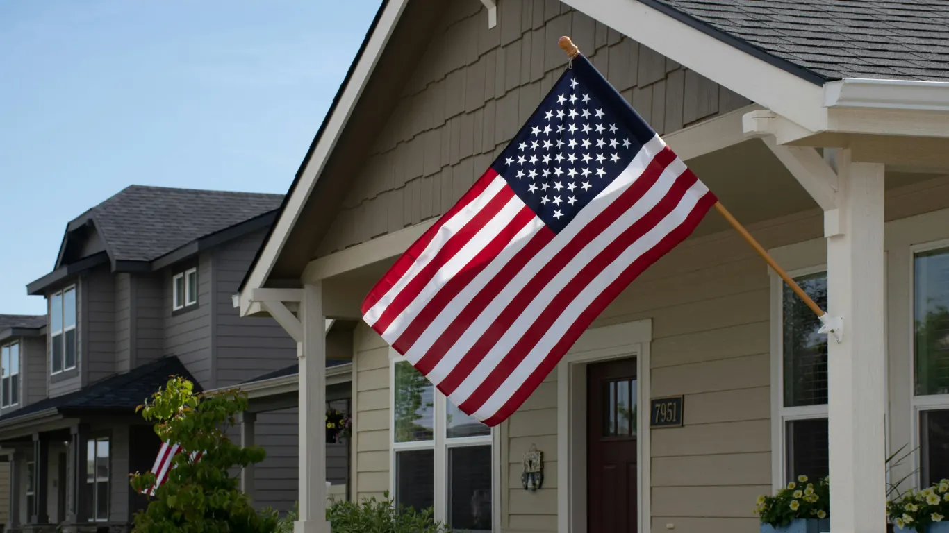 A house with the US flag on the porch