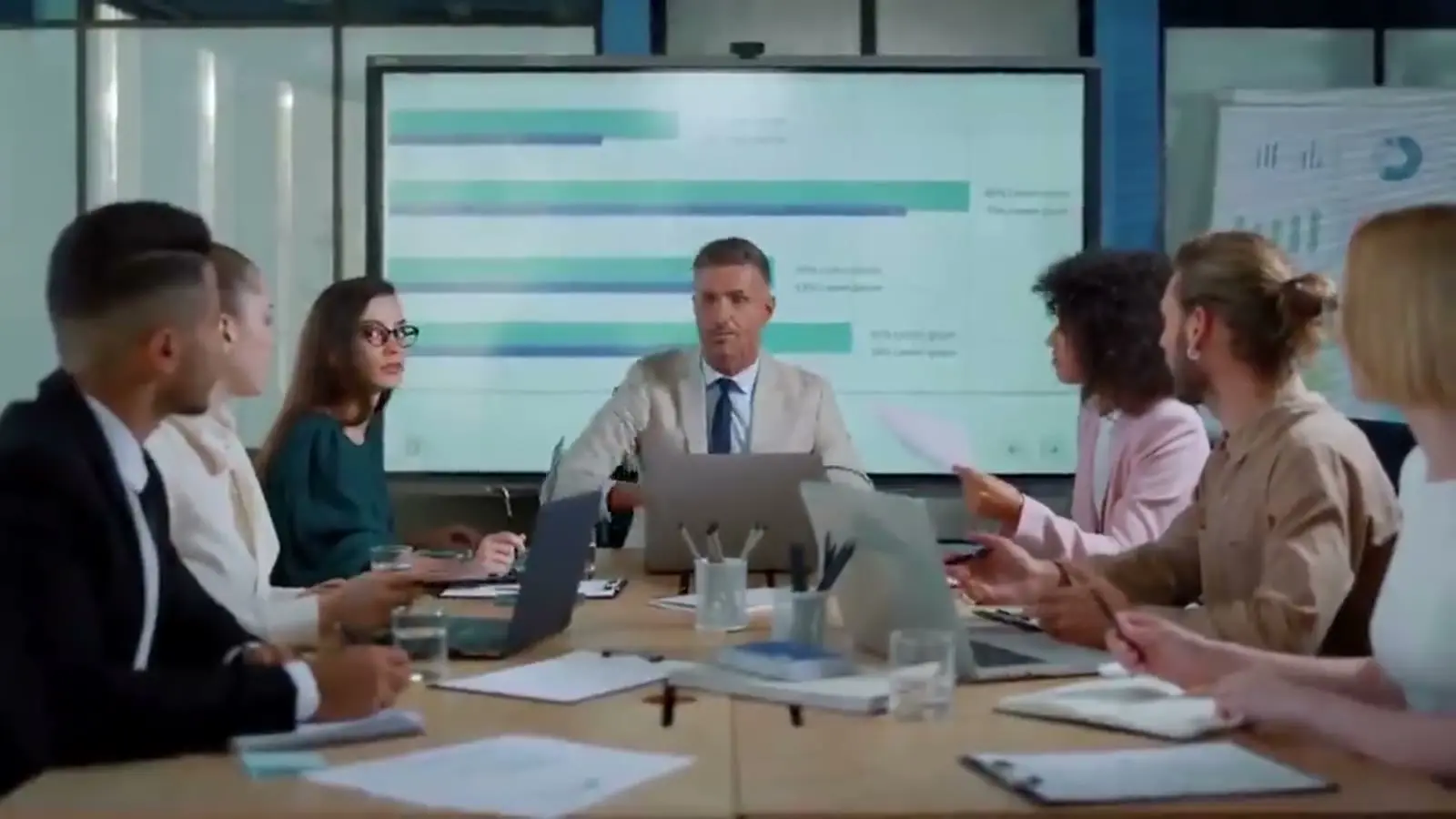 An advisory team meeting around a table