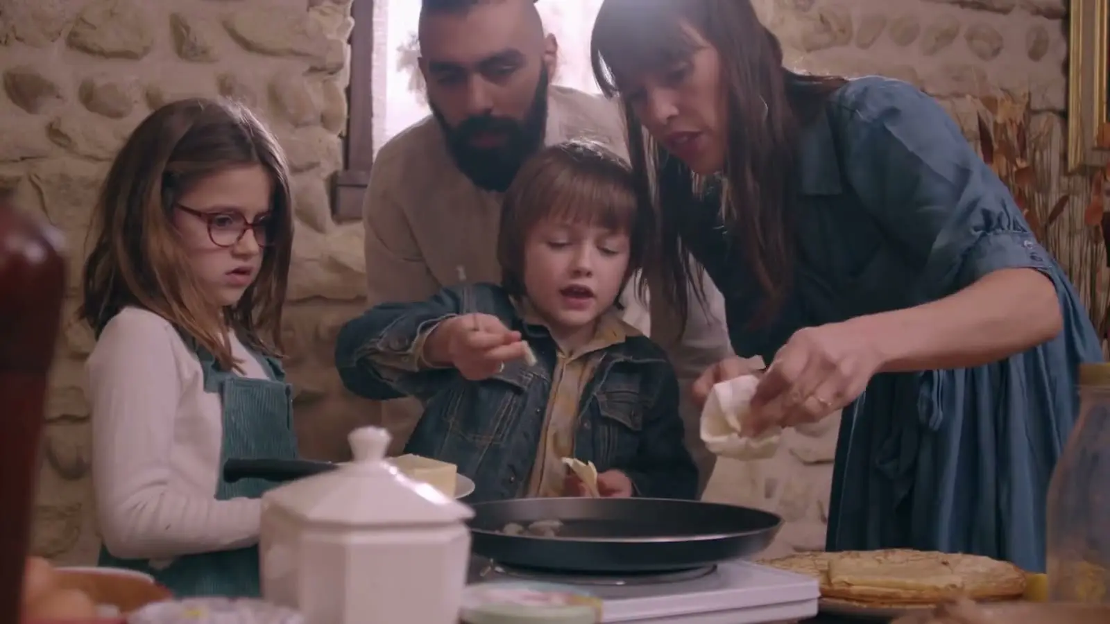 A family cooking together at home
