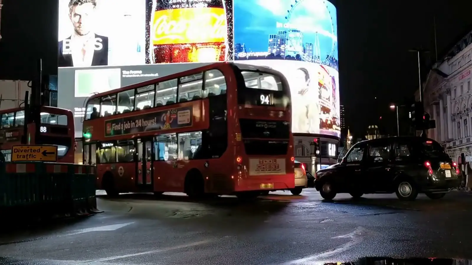 A London bus at Piccadilly Circus at night